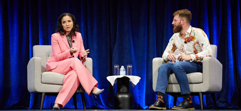 Adrienne Harris and Jonathan Levin discuss regulation on stage at the NYC Links conference.